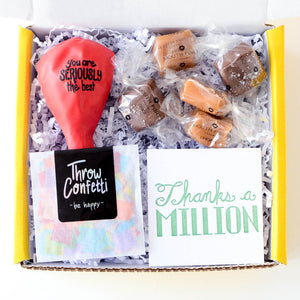 Thanks A Million Gift Box flatlay | Thank you gift box with balloon, confetti, and treat