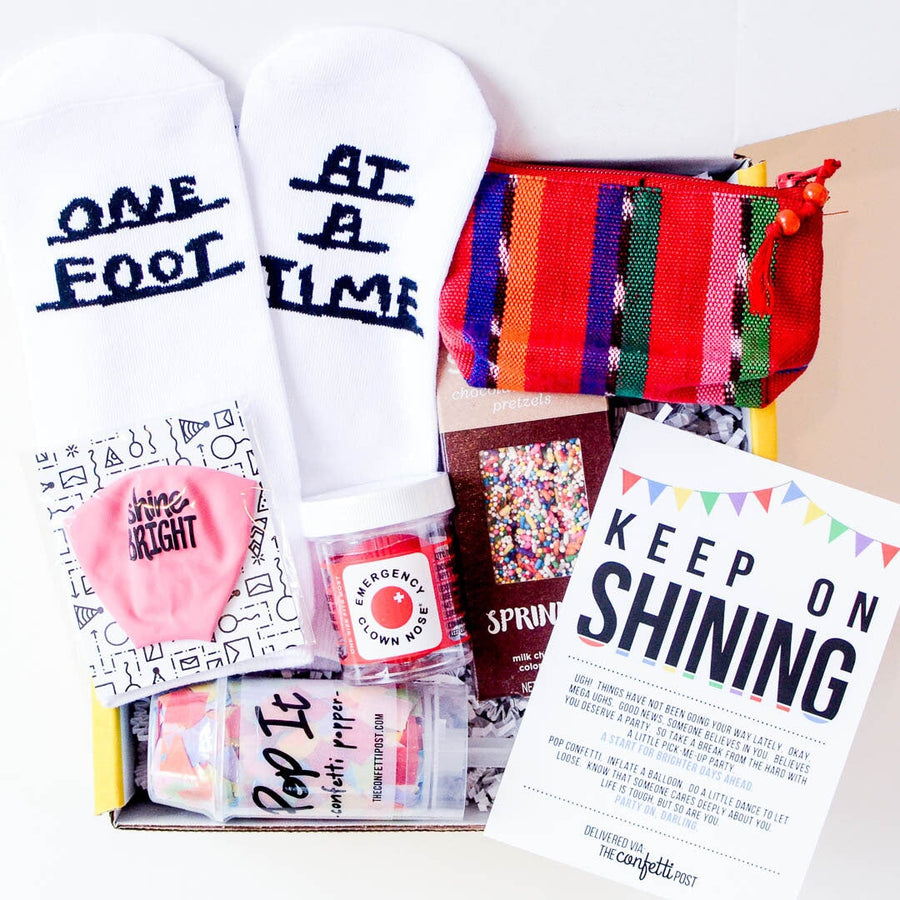 Keep on Shining Cheer Up Gift Package with socks, treat, clown nose, and colorful coin pouch